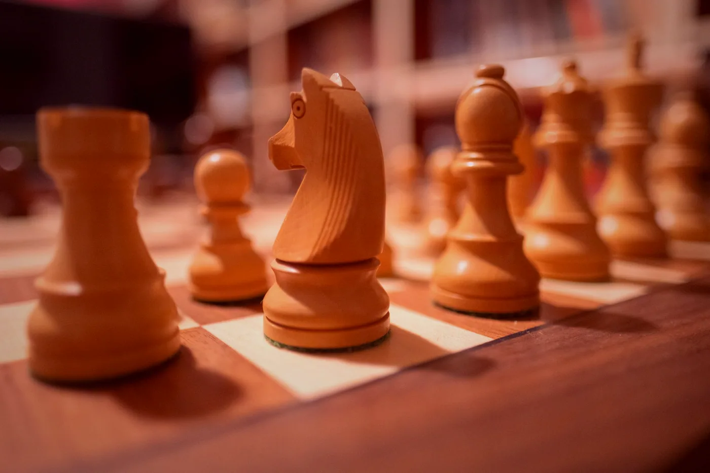 A round of a light board game in progress with dice and wooden pieces