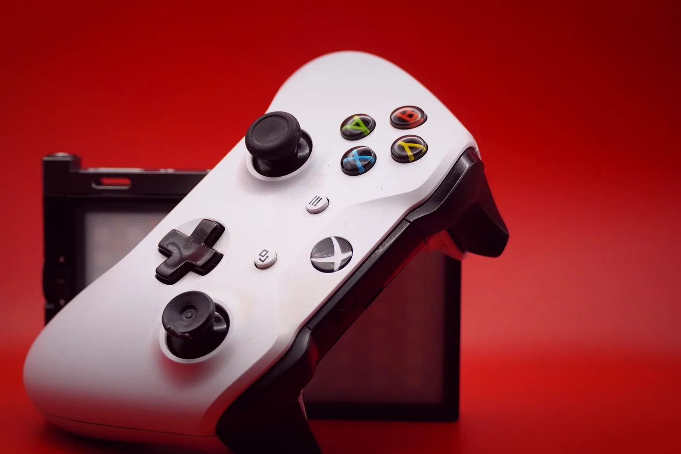 A controller left on the arm of a couch after a Tuesday night level